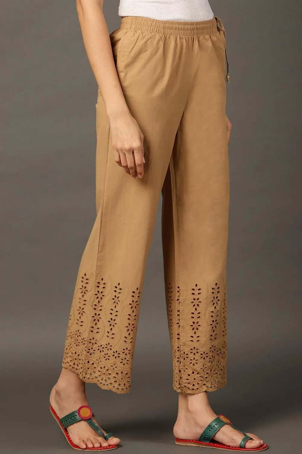 Beige Palazzos With Shimmery Details At The Hems