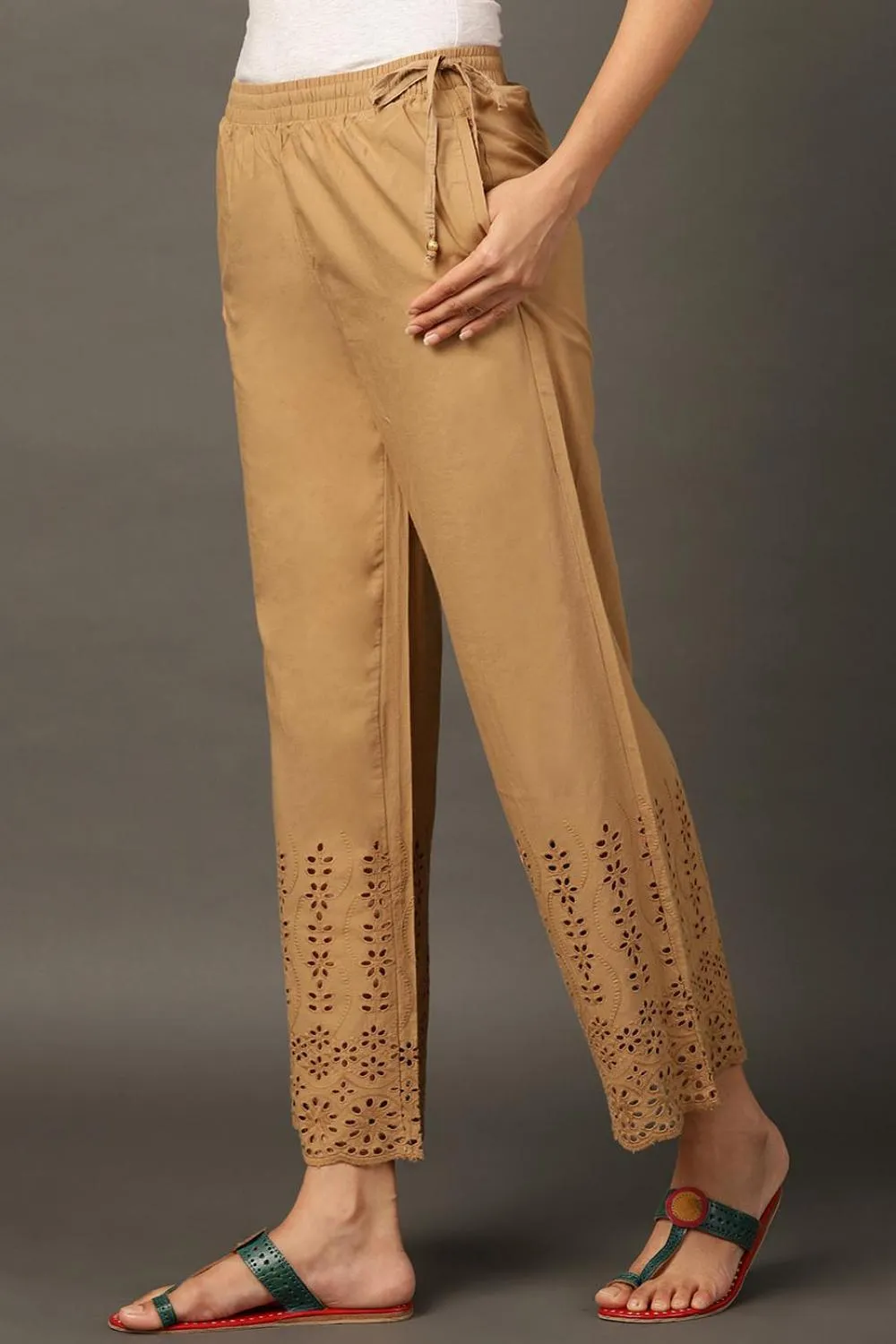 Beige Palazzos With Shimmery Details At The Hems