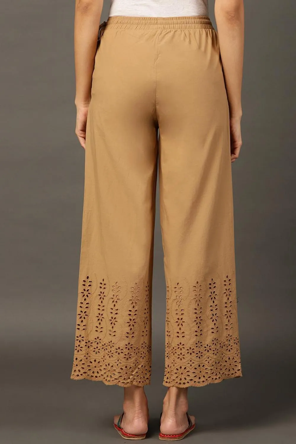 Beige Palazzos With Shimmery Details At The Hems